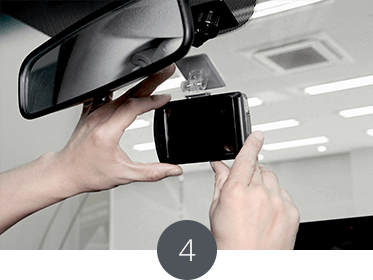 Place the product on the front window behind the room mirror horizontally with the car.